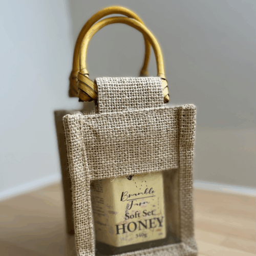 Single jar of Kent wildflower honey in gift bag with drizzler