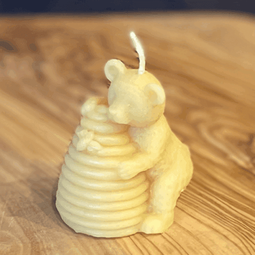 Hand poured pure beeswax candle in honey bear shape